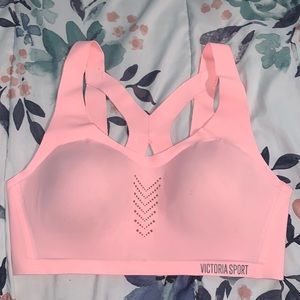 Pink Victoria’s Secret sports bra.
